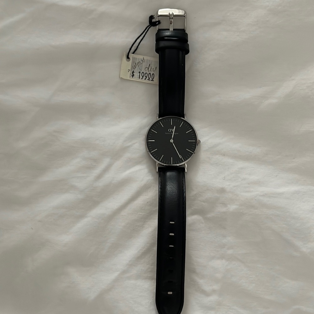 NWT. Black on black Daniel Wellington watch